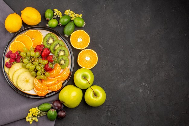 Top view fresh fruits mellow and ripe fruits on a dark background fresh vitamine mellow ripe fruit