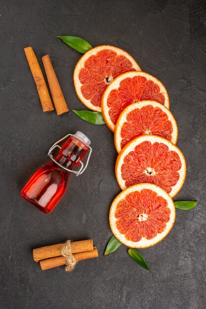 Top view fresh grapefruit slices on dark background