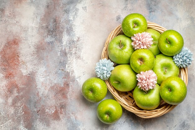 Top view fresh green apples inside basket