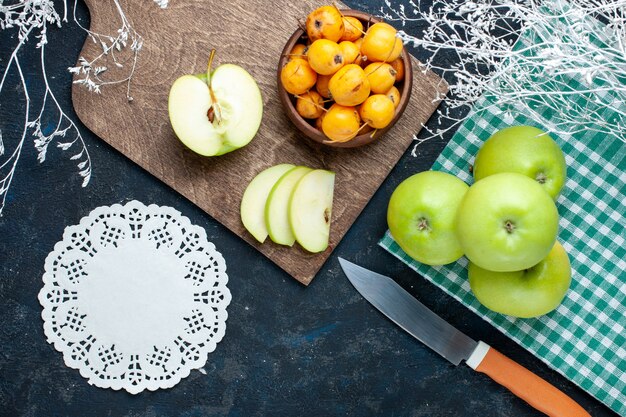 Top view of fresh green apples with sweet mellow cherries on dark, fruit fresh mellow food vitamine