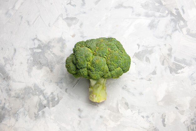 Top view fresh green broccoli on white table salad ripe health diet