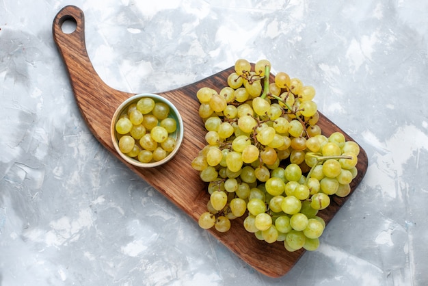 Top view of fresh green grapes juicy mellow on light-white, fresh fruit wine vitamine