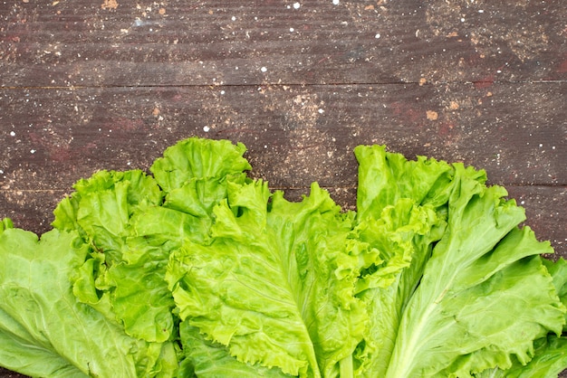 Top view fresh green salad on brown