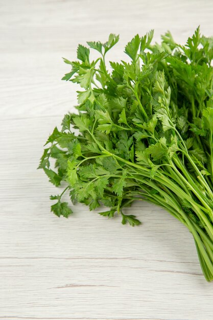 Top view fresh greens on a white background