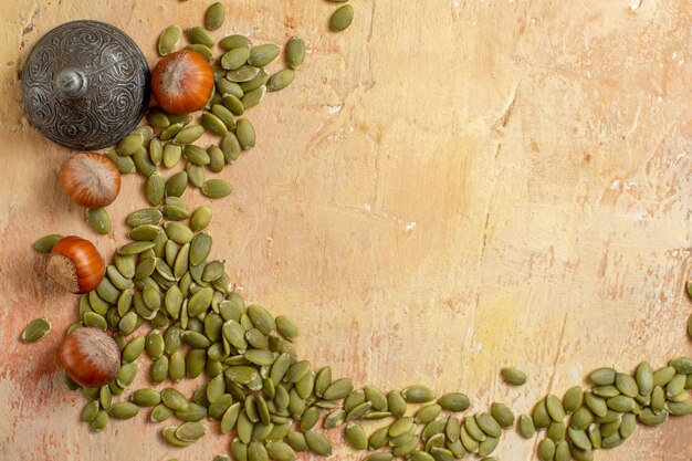 Top view of fresh hazelnuts and seeds