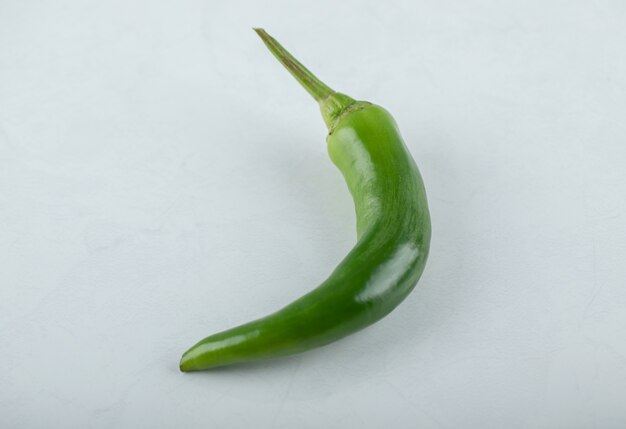 Top view of fresh hot peppers on white background. . 