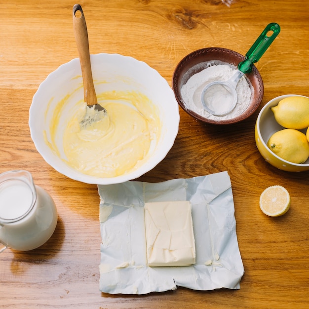 Free photo top view of fresh ingredients for making pie on wooden table