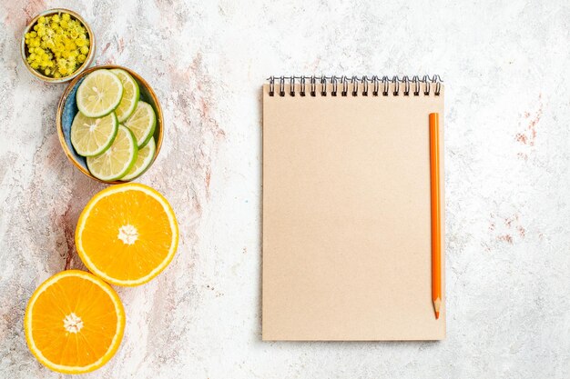 Top view fresh lemon slices with orange on white background citrus fruit juice color