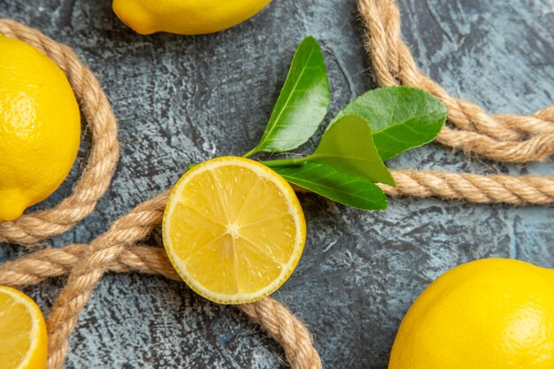 Top view fresh lemons with ropes