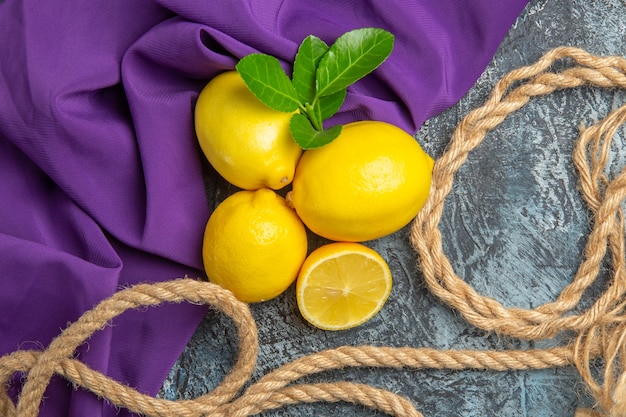 Top view fresh lemons with ropes