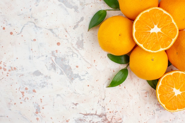 Top view fresh mandarines oranges on bright isolated surface with copy space