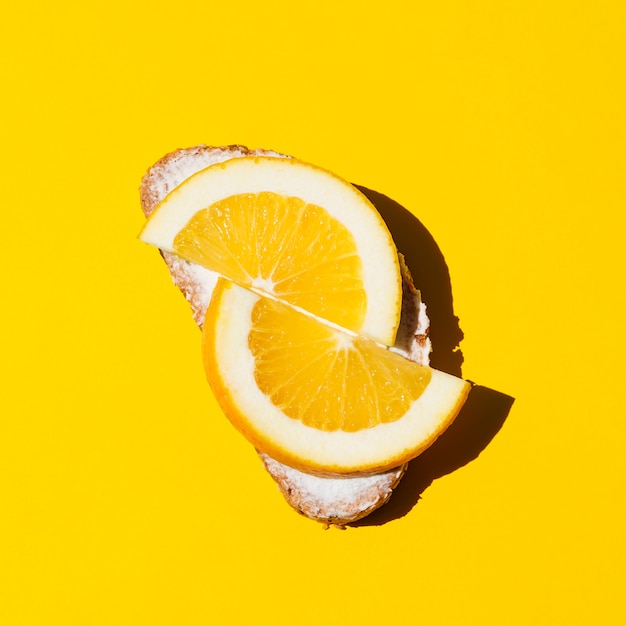 Top view fresh orange sandwich on a yellow background