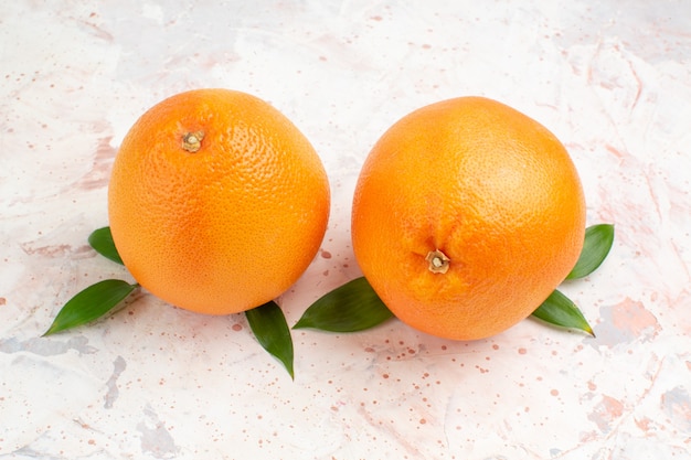 Top view fresh oranges on bright isolated surface