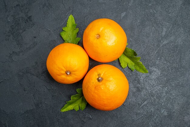 Top view fresh oranges on grey background