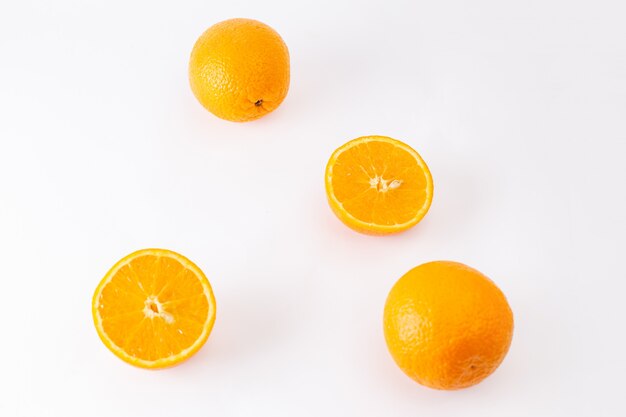 Top view fresh oranges juicy and sour on the white background exotic citrus color fruit