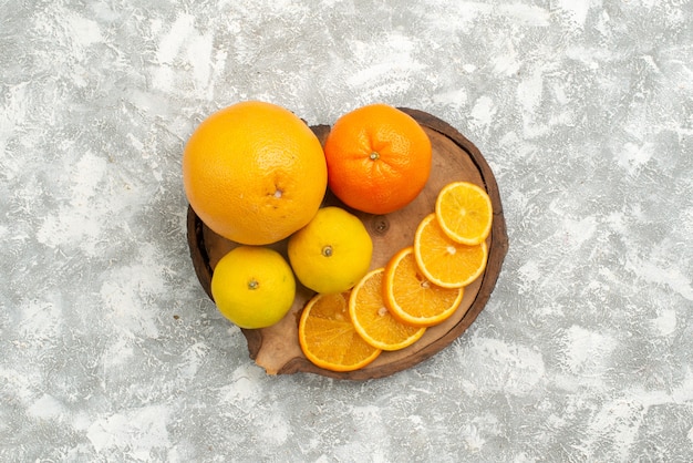 Top view fresh oranges with tangerines on a white background citrus exotic tropical fresh fruit