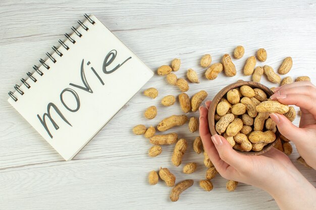 Top view fresh peanuts on white table, movie