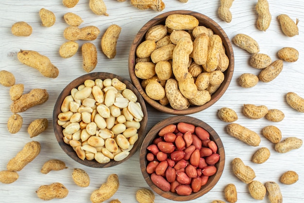 Top view fresh peanuts on white table