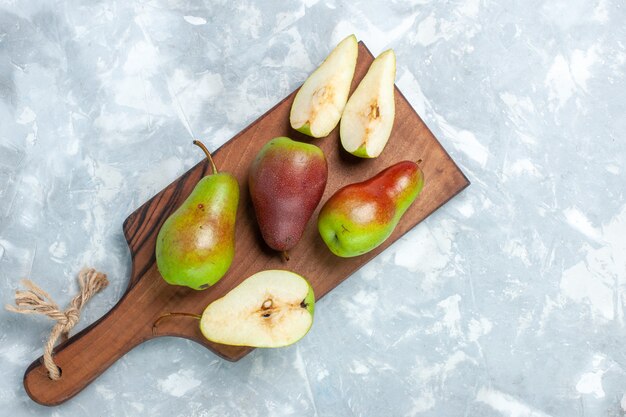 Top view fresh pears sliced on light-white background.