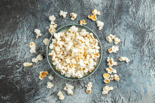 Top view fresh popcorn on light surface