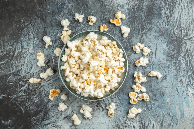 Top view fresh popcorn on light surface