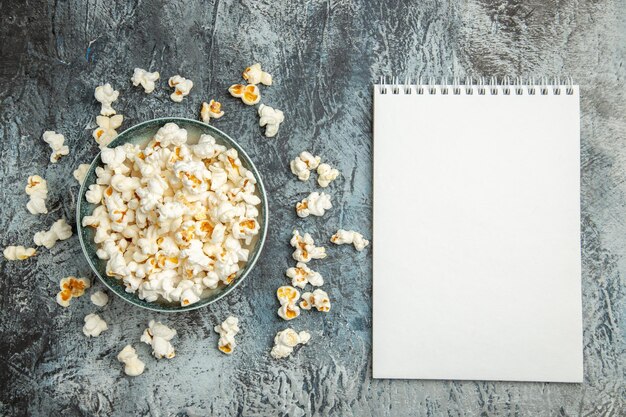 Top view fresh popcorn on light surface