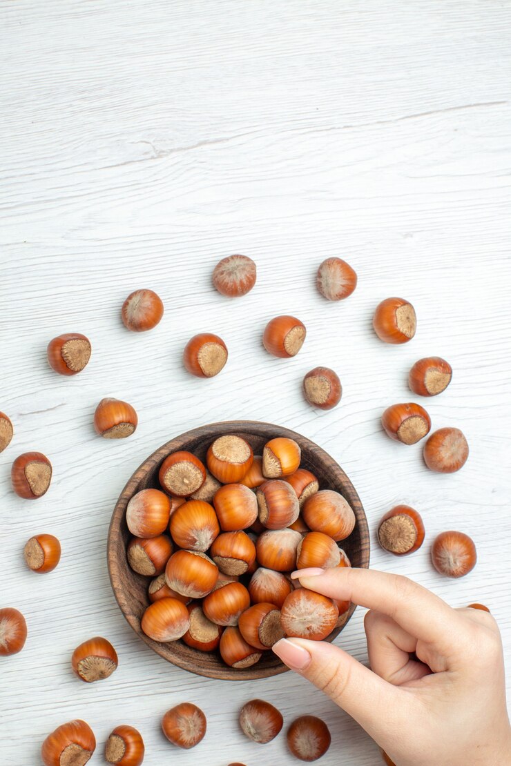 Free Photo top view fresh raw hazelnuts on white desk nut movie plant food walnut snack