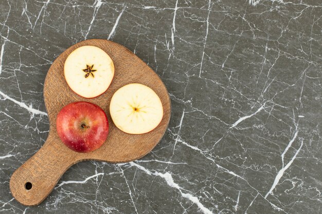 Top view of fresh red apple. on grey.