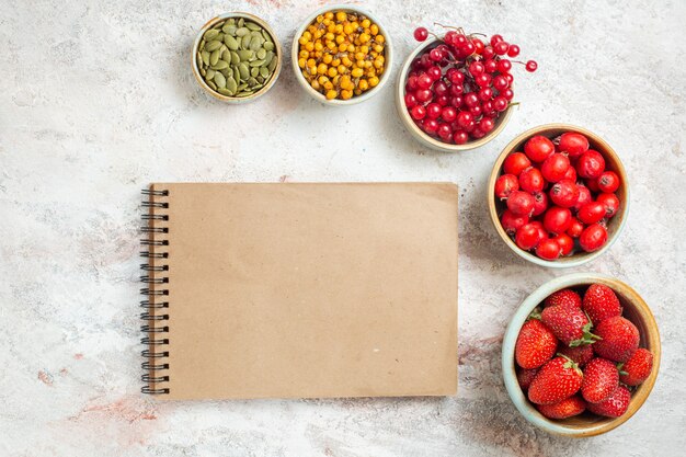 Top view fresh red fruits on white table fruit color fresh