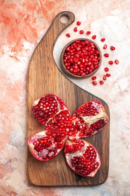Top view fresh red pomegranates on a light background