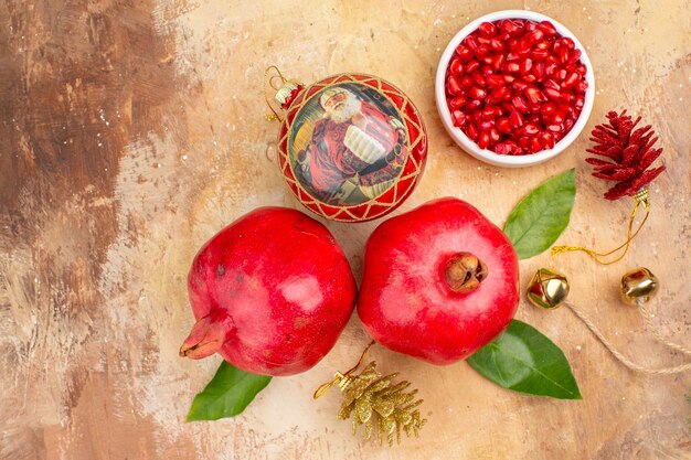 Top view fresh red pomegranates on light background