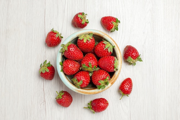 Top view fresh red strawberries on white desk