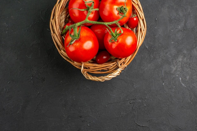 Top view fresh red tomatoes inside basket