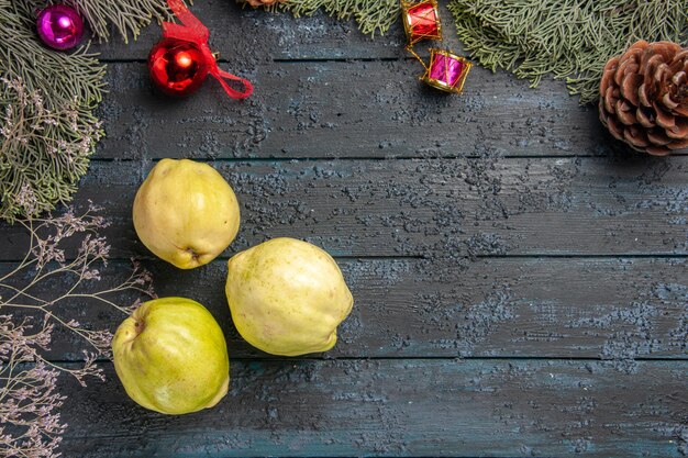 Top view fresh ripe quinces sour fruits on a dark-blue rustic desk fresh plant ripe tree fruits