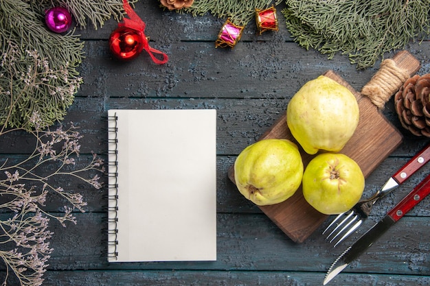 Top view fresh ripe quinces sour fruits on a dark-blue rustic desk many fresh plant ripe fruit tree