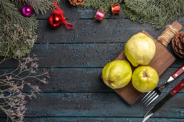 Top view fresh ripe quinces sour fruits on dark-blue rustic desk many fresh plant ripe fruit tree