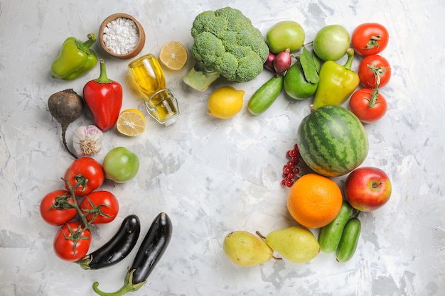 Top view fresh ripe vegetables with fruits on white background