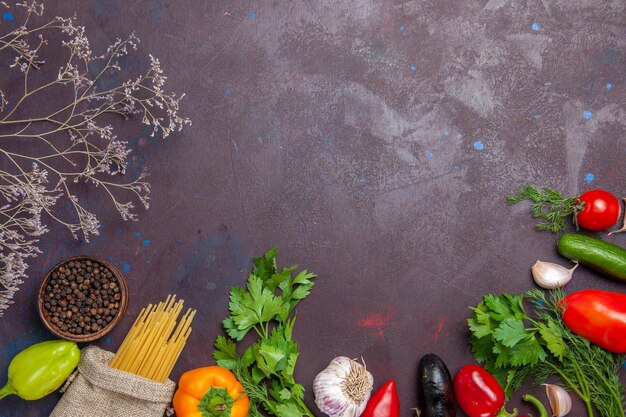 Top view fresh ripe vegetables with greens on dark surface salad meal vegetable ripe color