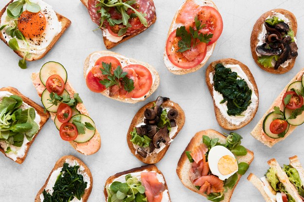 Top view fresh sandwiches arrangement on white background