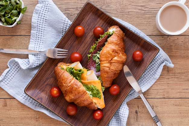 Top view fresh sandwiches arrangement on wooden background