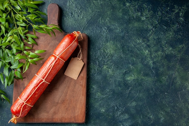 Top view fresh sausage on dark-blue background meal bread bun meat burger animal sandwich food color free space