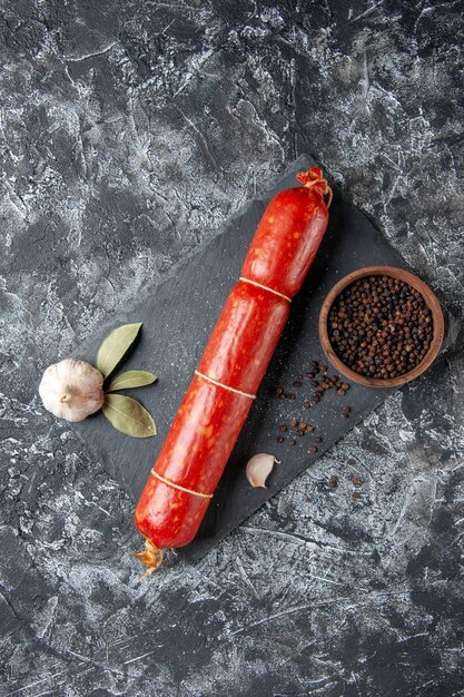 Top view fresh sausage with pepper on a light dark background sandwich meat food burger bread meal color animal