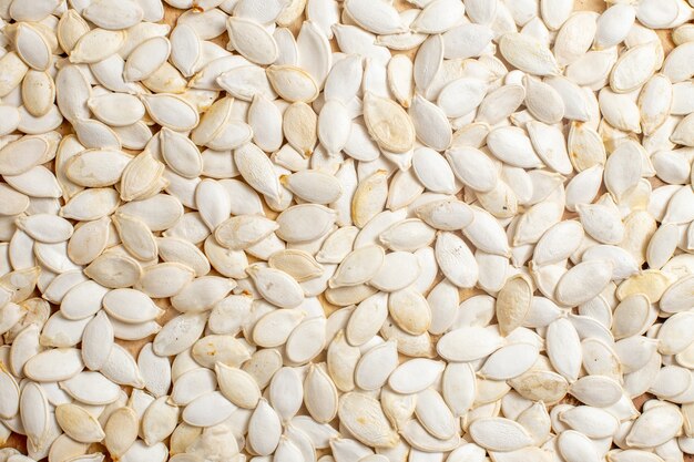 Top view of fresh seeds lined on a wooden desk