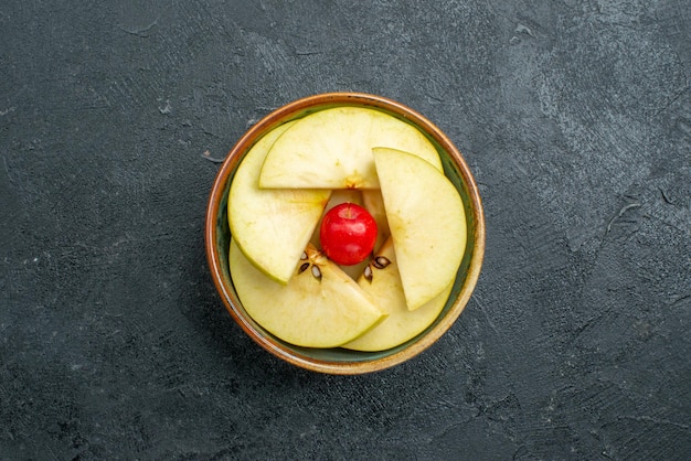 Top view fresh sliced apples inside little pot on grey surface fresh fruit mellow ripe
