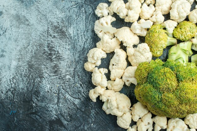 Top view fresh sliced cauliflower on light-grey table