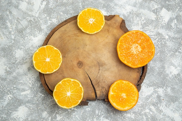 Top view fresh sliced oranges on white surface citrus juice ripe fresh fruit