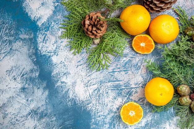 Top view fresh tangerines on light-blue background