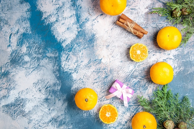 Top view fresh tangerines on light-blue background