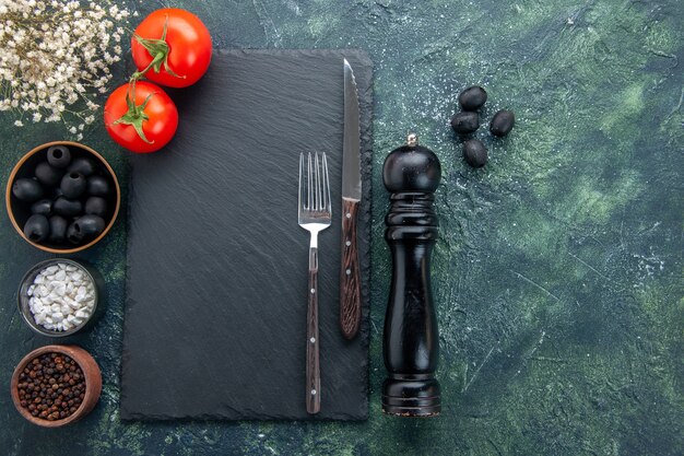 top view fresh tomatoes with seasonings and olives on dark background