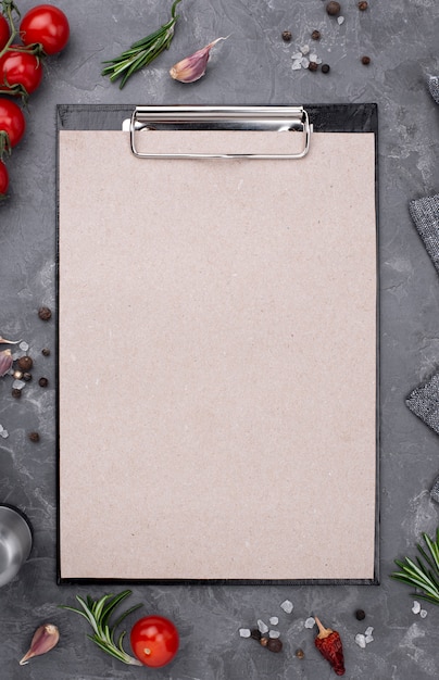 Top view fresh vegetables beside clipboard